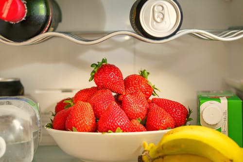 Close-Up Shot of Fresh Strawberries on Ceramic Bowl