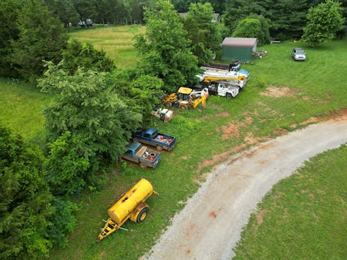 Aerial Photography of Parked Tractors on a Grass Field