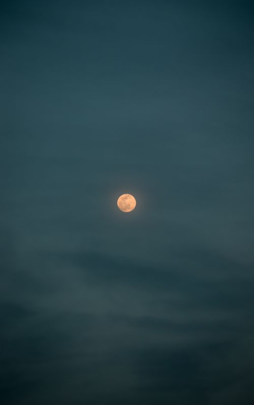 Free A serene view of the full moon glowing in the night sky over İzmir, Turkey. Stock Photo