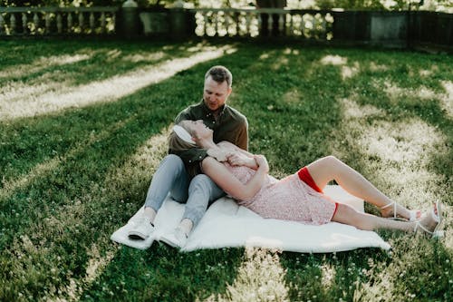 Couple Lying Down on Grass