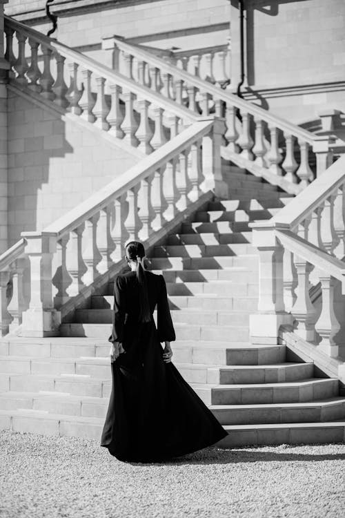 Woman in Dress near Stairs