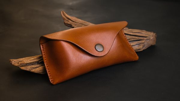 Handmade leather goods on wood — Bilakis on Pexels
