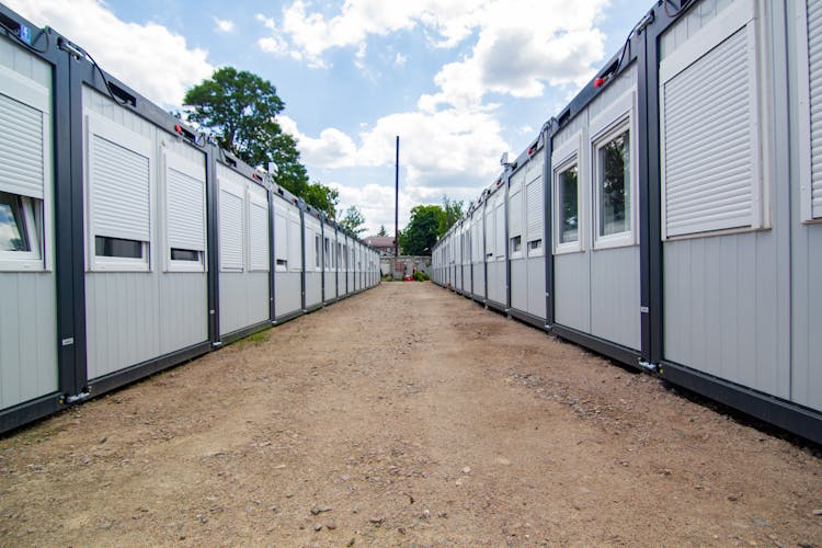 Dirt Road Between Rows Of Barracks