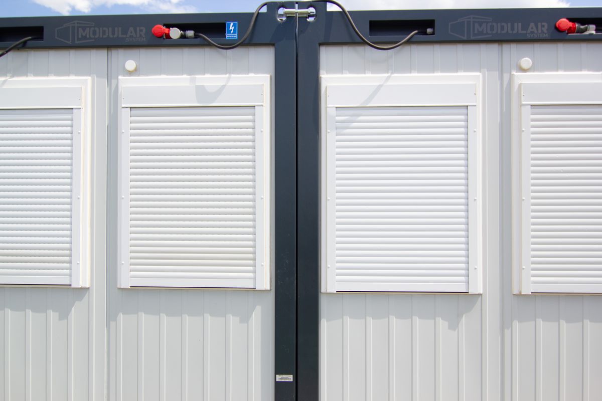 Modular building with white shuttered windows
