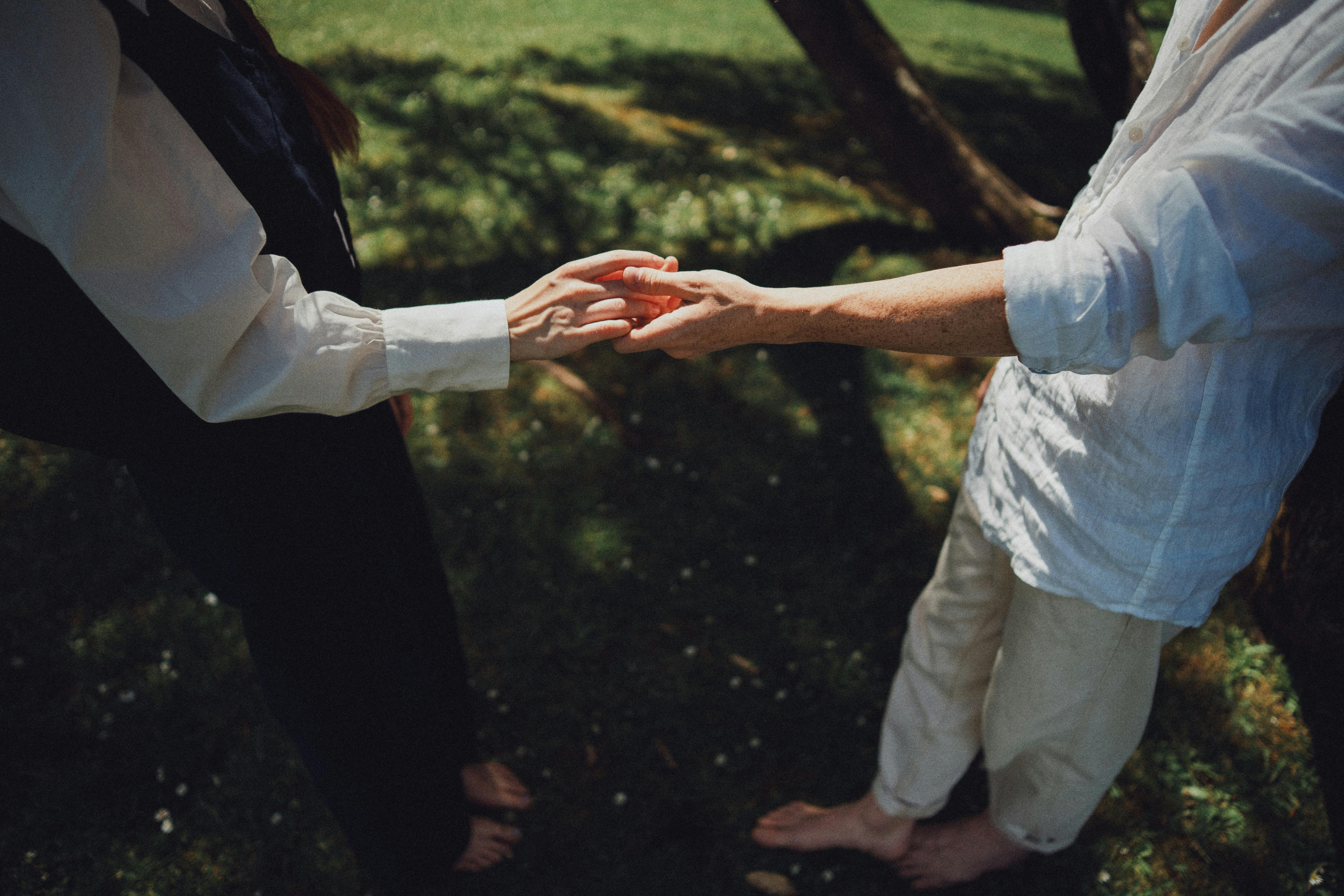 Photo of Persons Holding Hands · Free Stock Photo