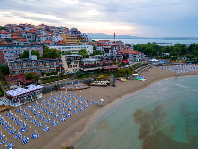 Sunbeds On Beach In Town