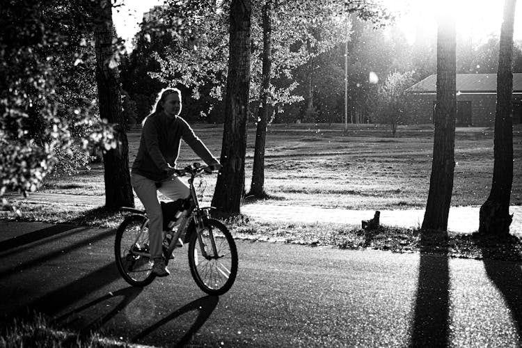 Woman Riding A Bike 