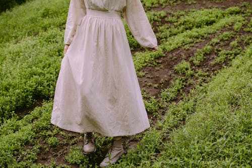 Woman Standing in a Field