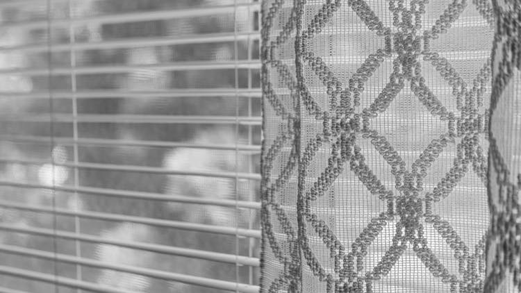 Grayscale Photo Of A Curtain