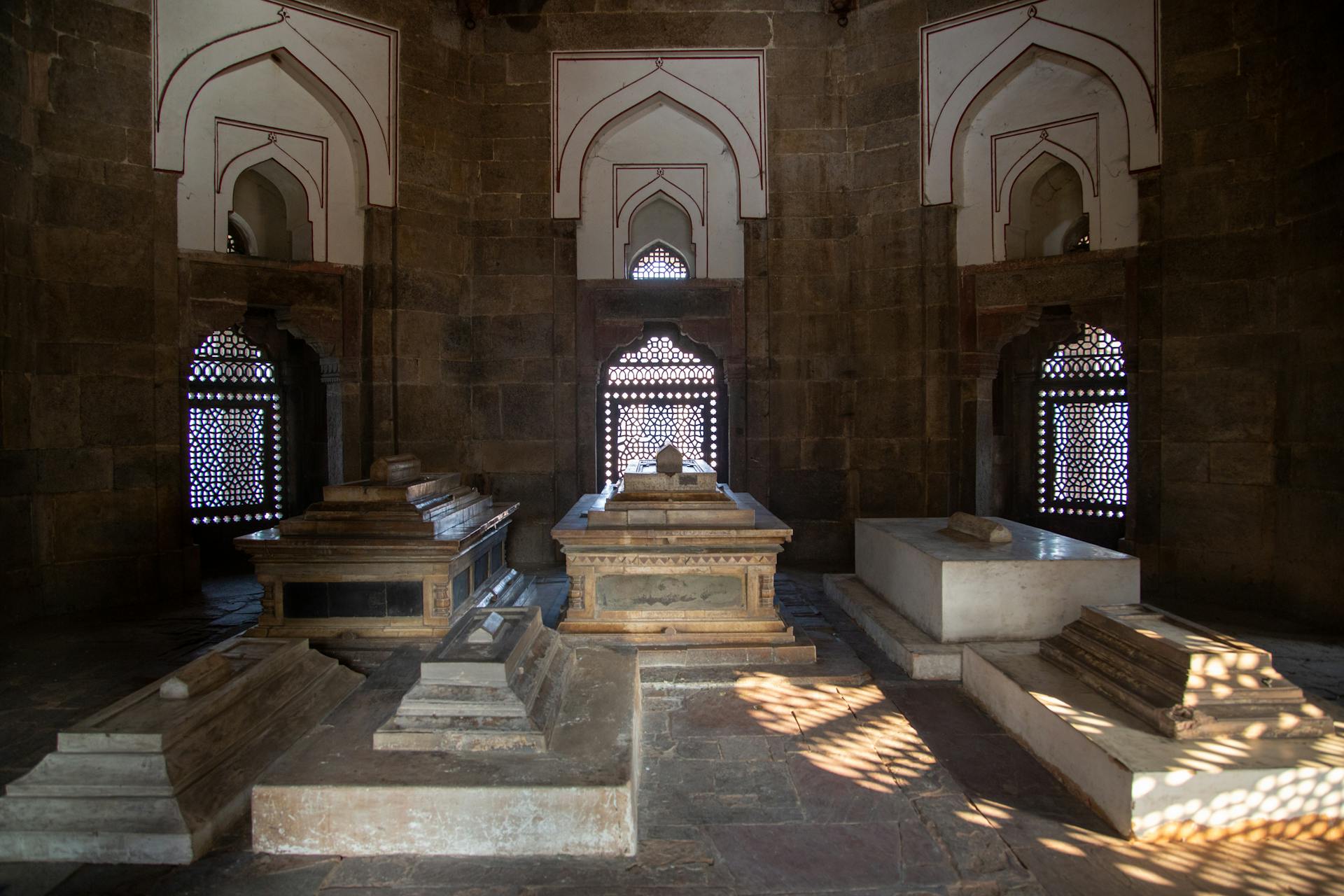 Interior view of tombs inside Isa Khan's Tomb, Delhi, showcasing Indo-Islamic architecture.