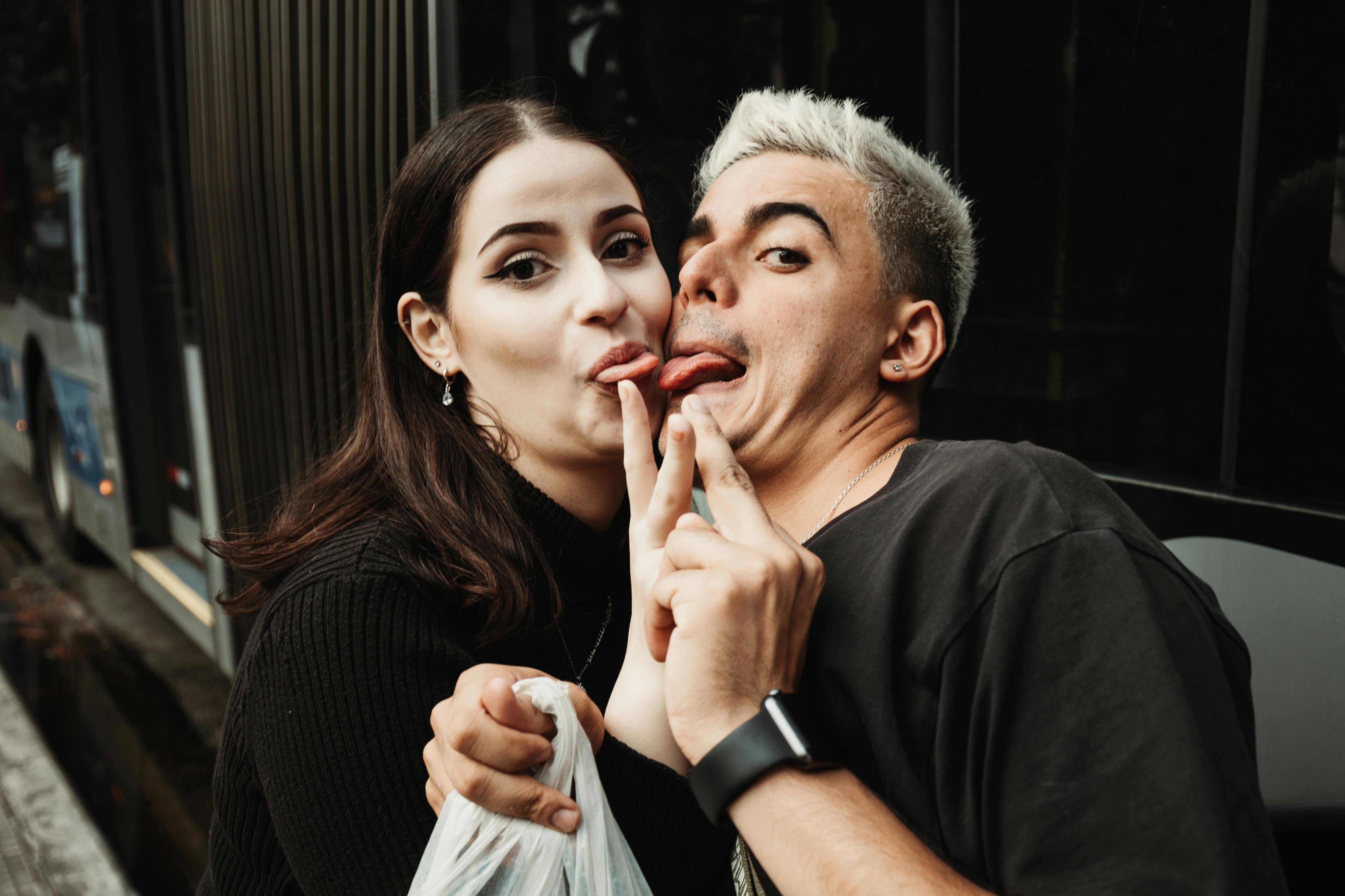 A Couple Sticking their Tongues Out · Free Stock Photo