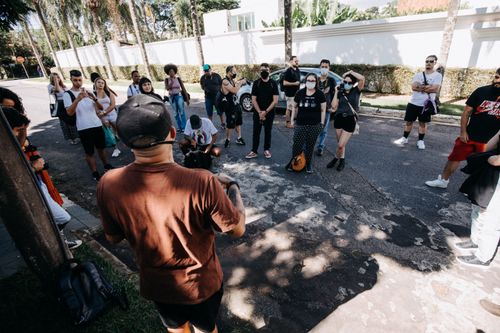 Free A diverse group of people on a guided tour during a sunny day on an urban street. Stock Photo