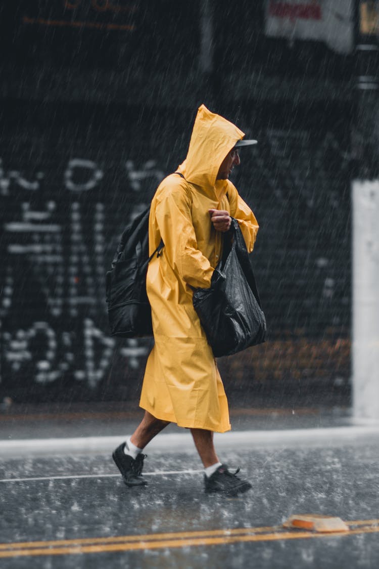 Man On Street During Downpour