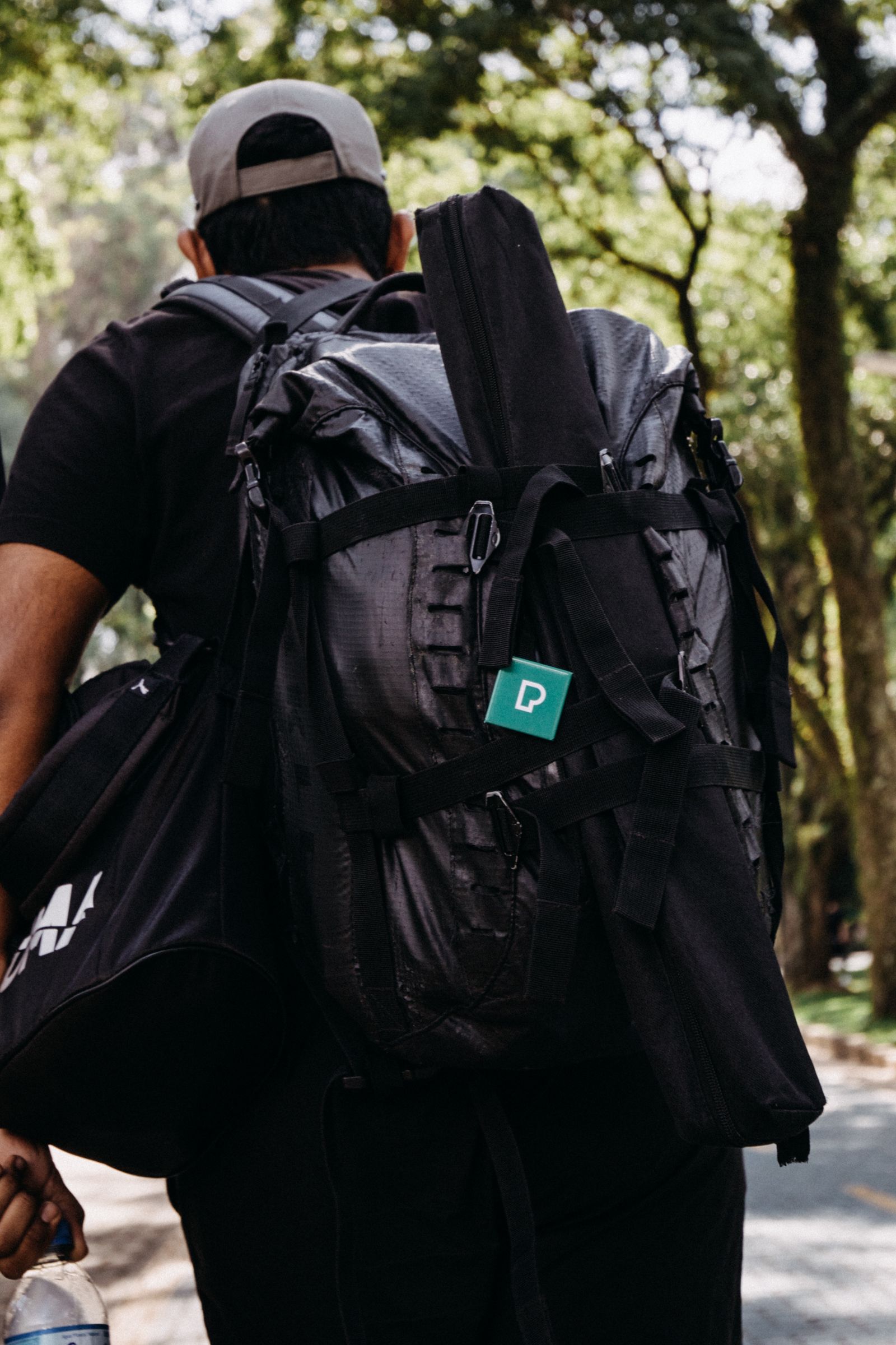 Hiker wearing a backpack on a forest trail