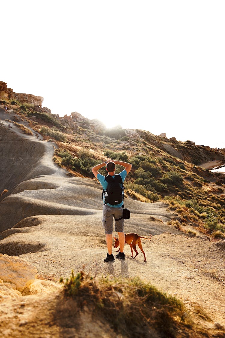 Man Hiking With Dog