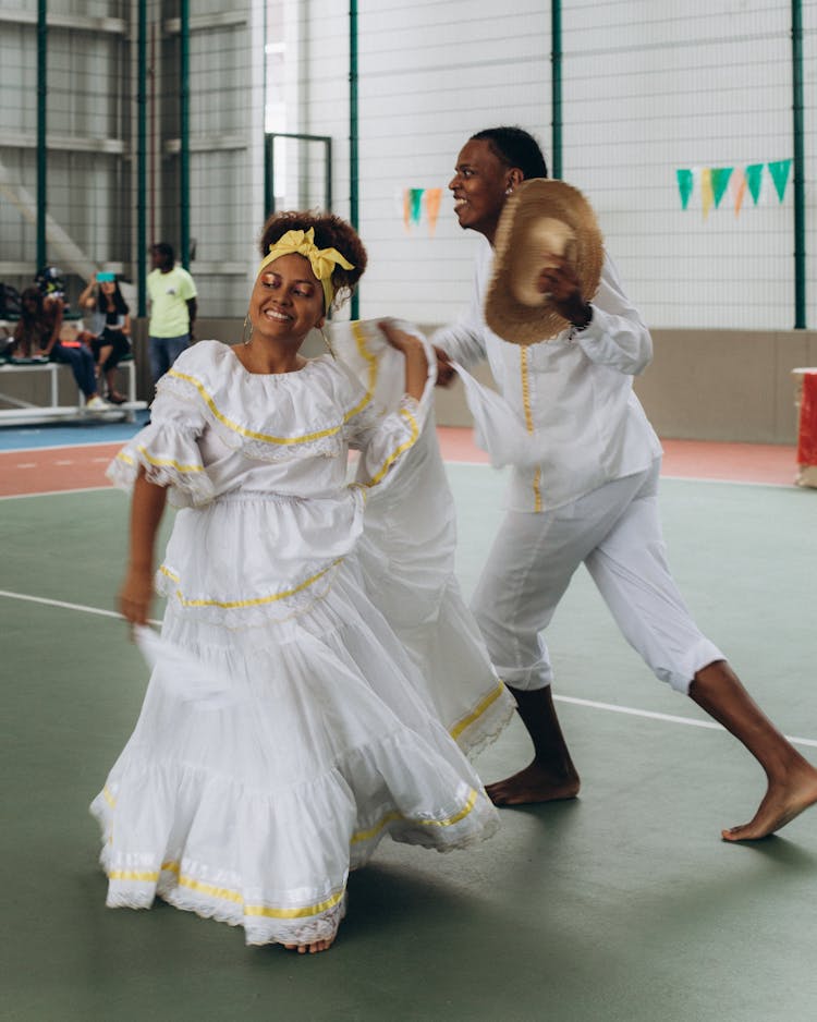 Man And Woman In White Clothes Dancing