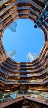 Stunning low angle view of iconic modern structure against clear blue sky.