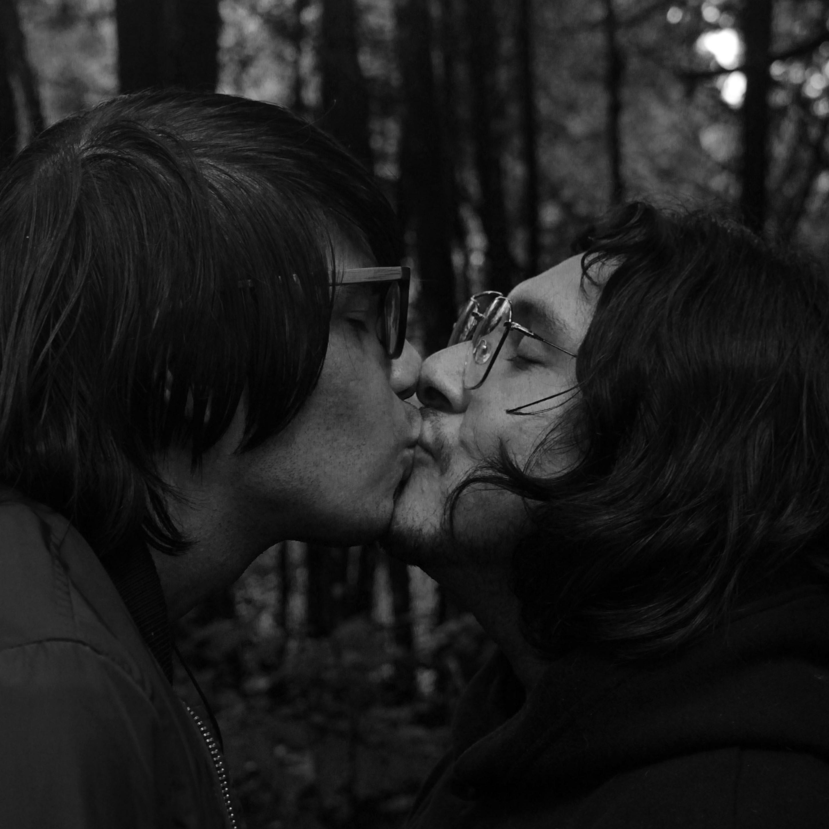 A Couple Kissing in the Woods · Free Stock Photo