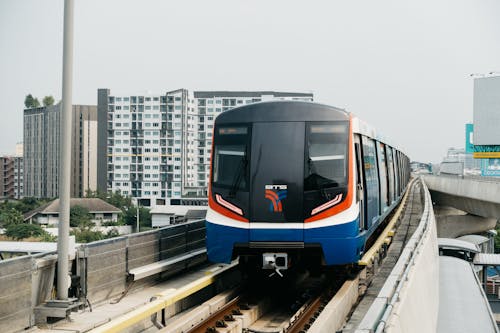 Blue and White Train on Rail