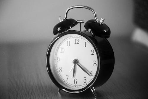 Black and White Photo of an Alarm Clock