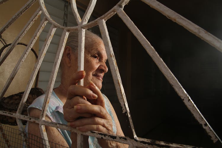 Woman Face Behind Bars