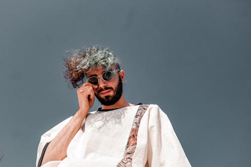 A Man in White Shirt Wearing Sunglasses