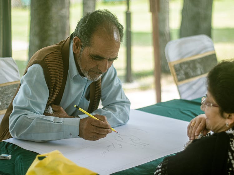 A Man Doing Calligraphy