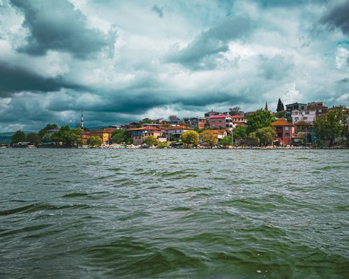 Free Scenic view of Bursa's colorful waterfront under a dramatic sky, Turkey. Stock Photo