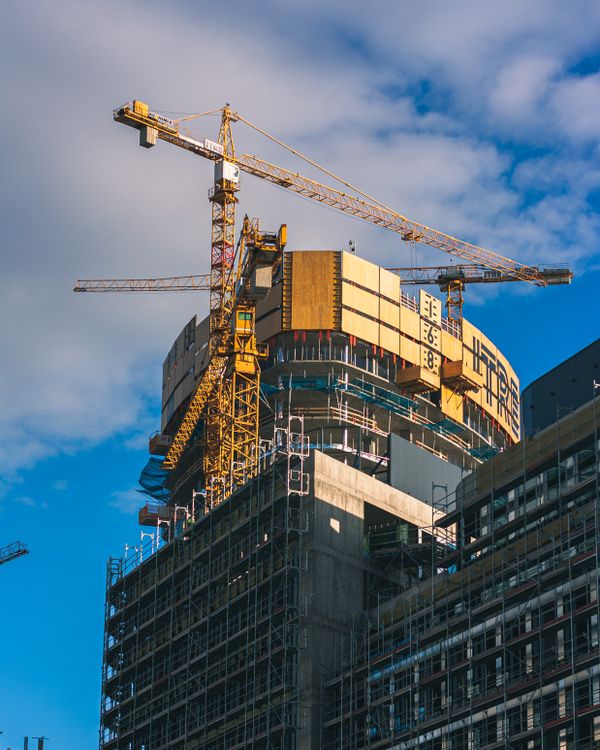 Skyscraper In Construction Tower Cranes by Office Building under Construction · Free Stock Photo