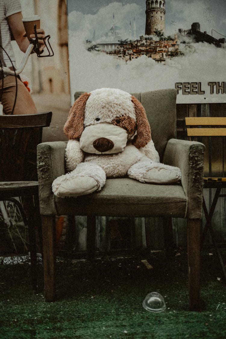 Stuffed Toy Sitting On Armchair