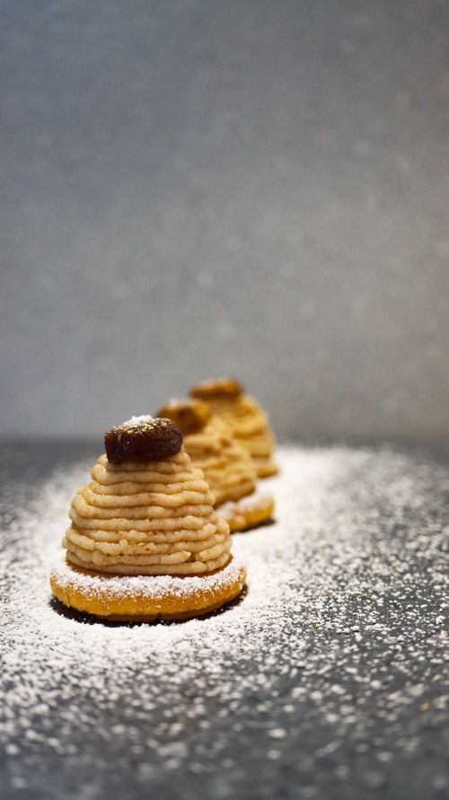 Free Delectable pastries topped with powdered sugar on a slate background. Stock Photo