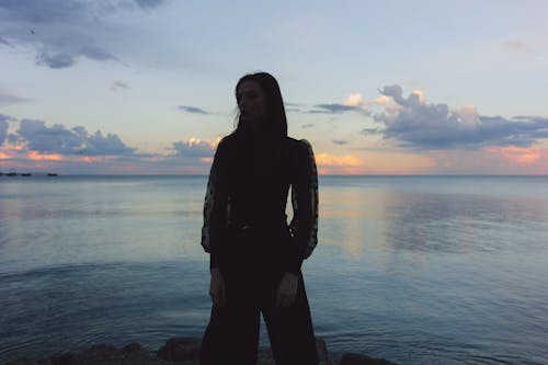 Silhouette against Sea in the Evening