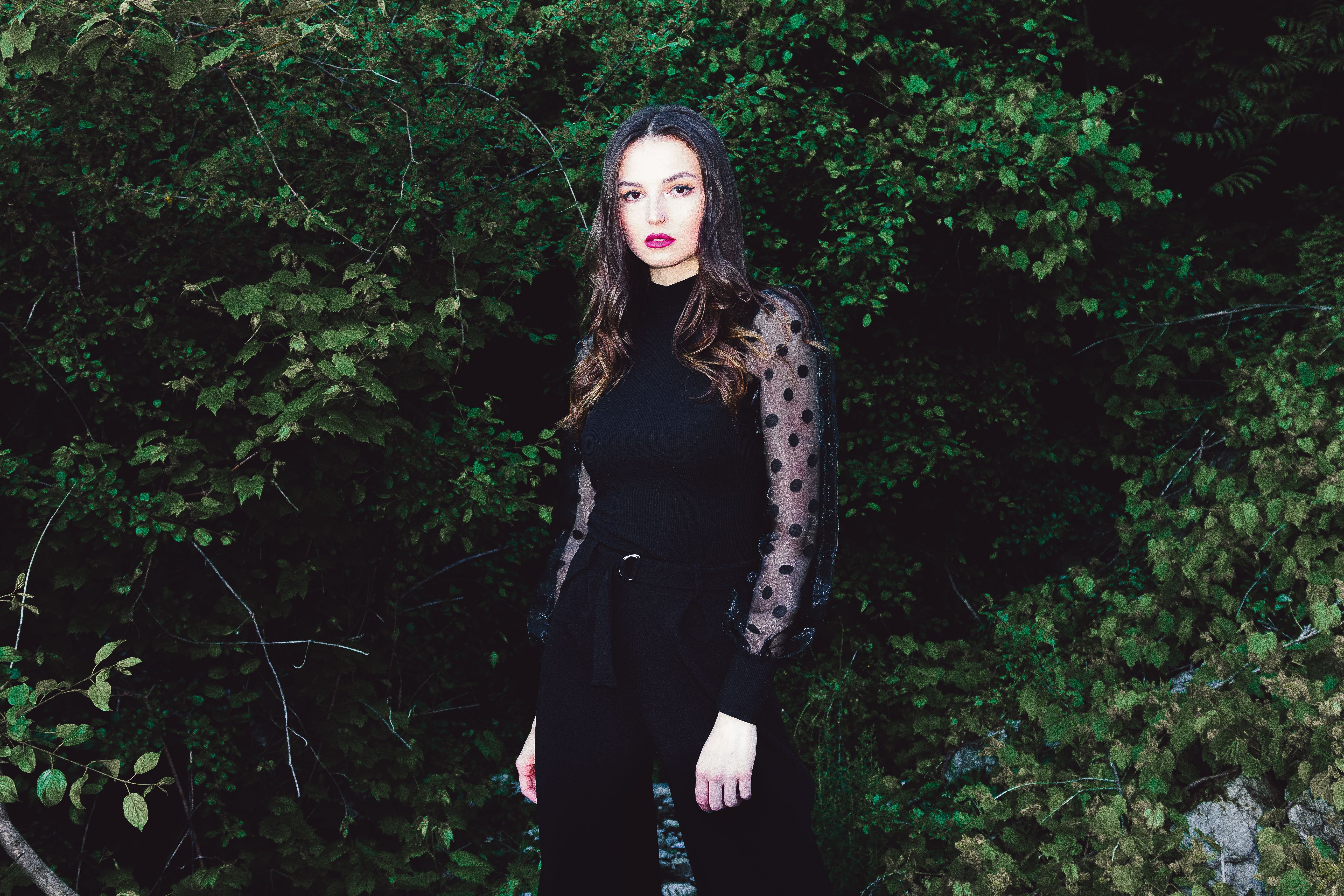 Woman in Elegant Outfit Posing in Park · Free Stock Photo