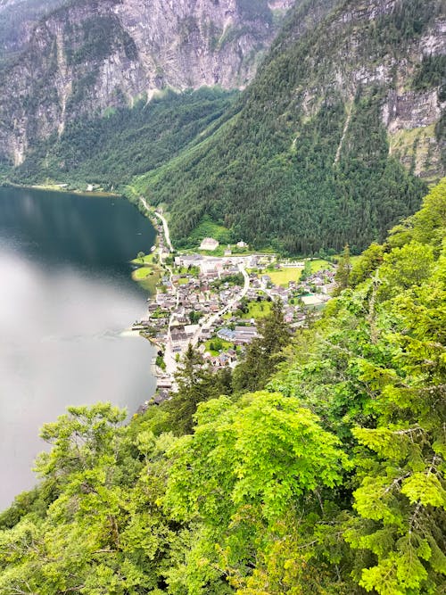 Village in Valley by Mountain Lake