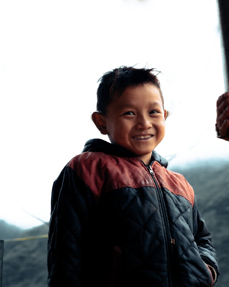 A Boy Wearing A Jacket 