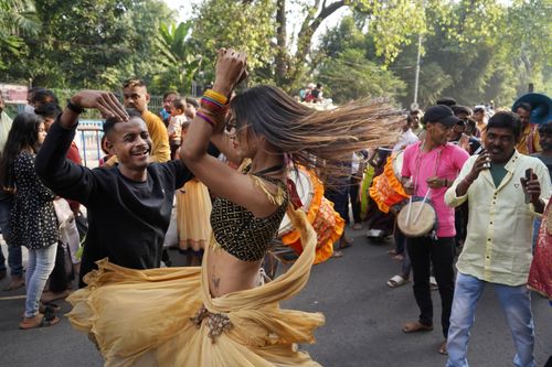 Free Colorful Indian festival with people dancing and drumming on the streets of Kolkata. Stock Photo