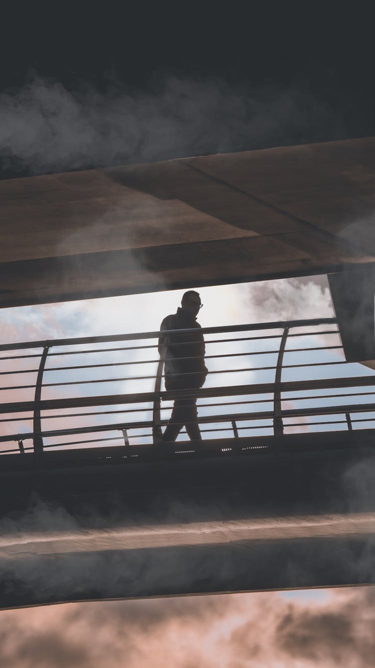 Man Walking Down The Sky Bridge 