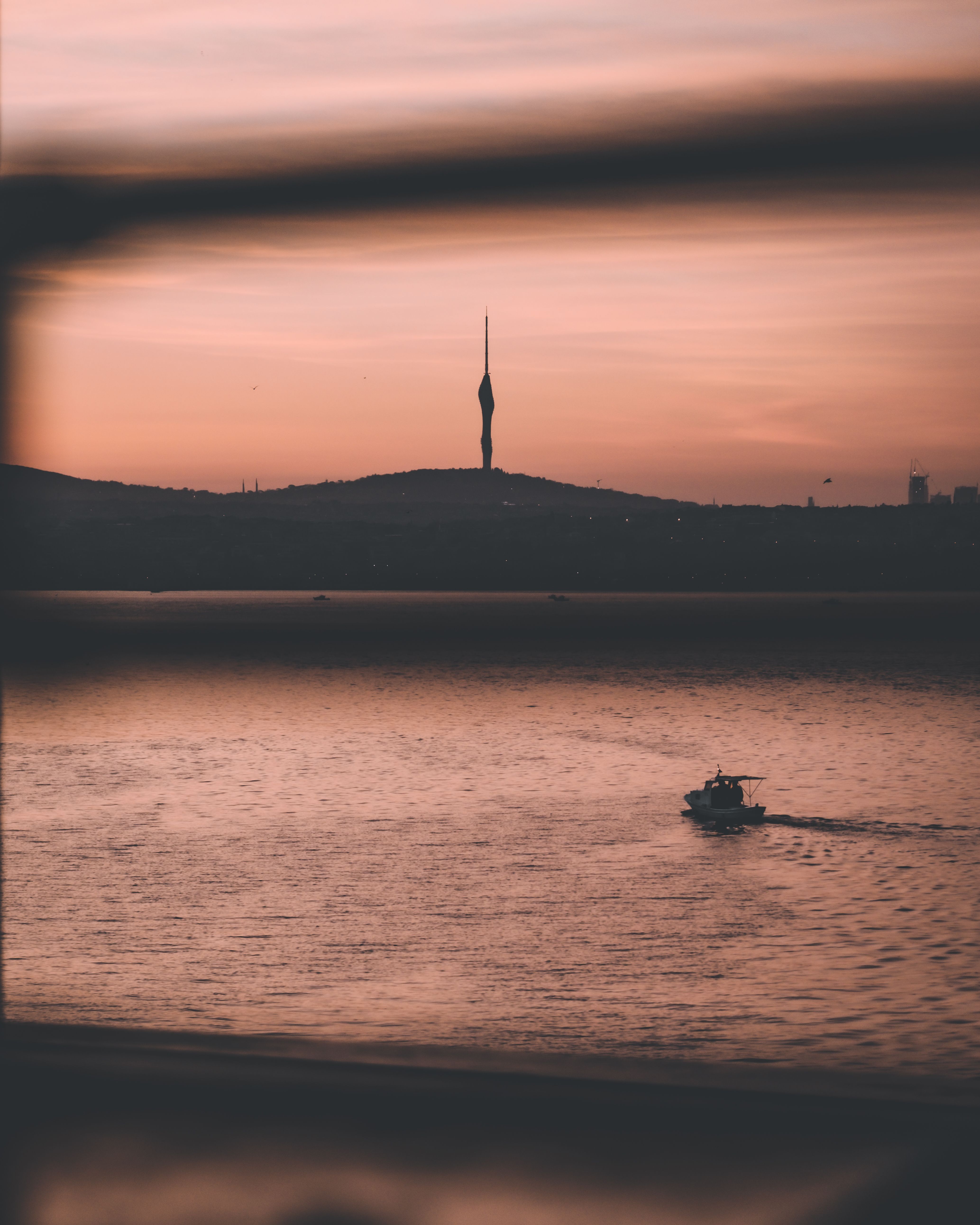 Silhouette of Boat on Sea during Sunset · Free Stock Photo