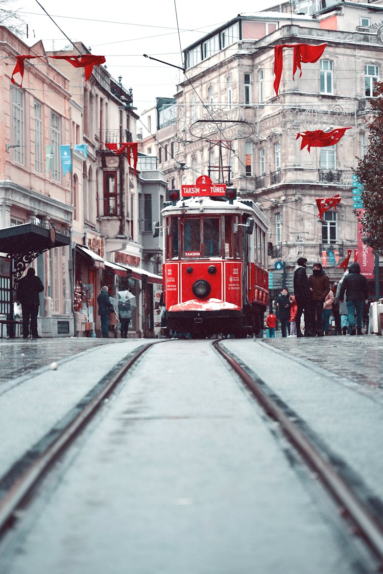 People Walking On The Street Near The Tram