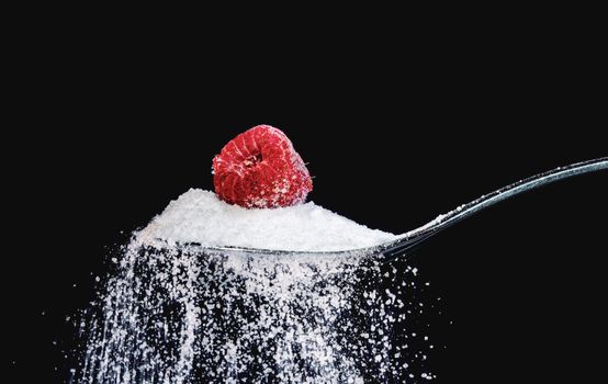 Close-Up Photo of a Spoon with Sugar and Raspberry