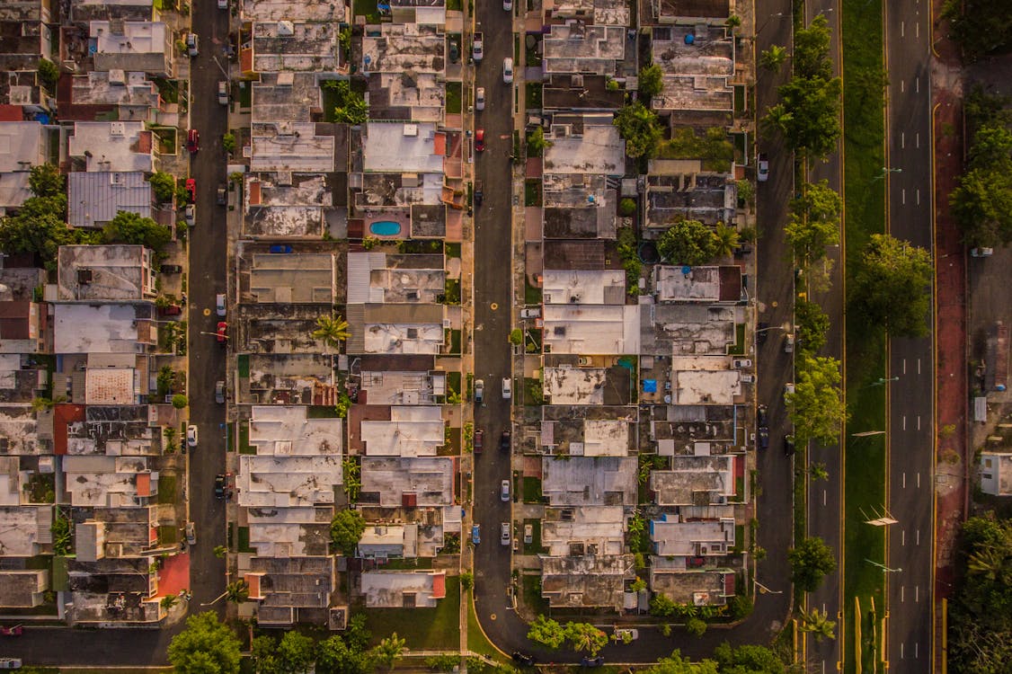 An Aerial Photography of Houses Near the Streets