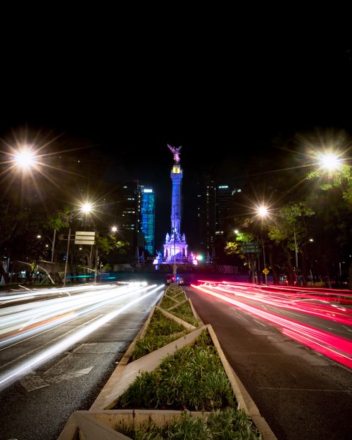 Free Long exposure of light trails on Paseo de la Reforma with Angel of Independence illuminated at night in Mexico City. Stock Photo