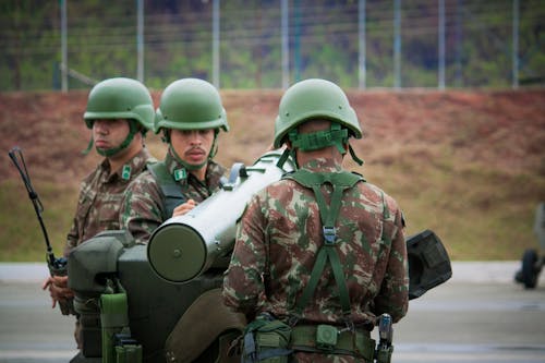 Free Three Men Wearing Camouflage Uniform during Military Training Stock Photo