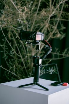 High-quality Canon camera on a gimbal tripod ready for shooting in a studio setting.