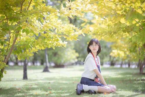 Young Student Sitting at a Park