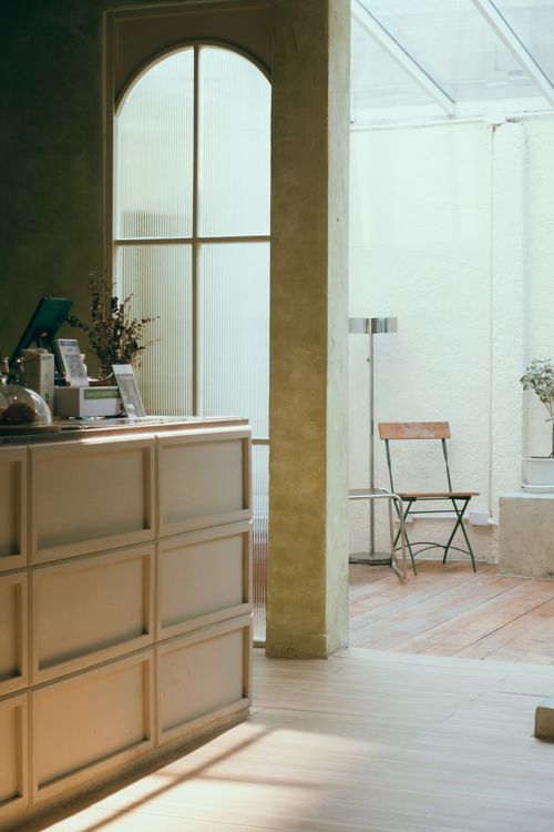 Free Bright modern indoor space with wooden flooring and minimalist design elements in Bangkok. Stock Photo