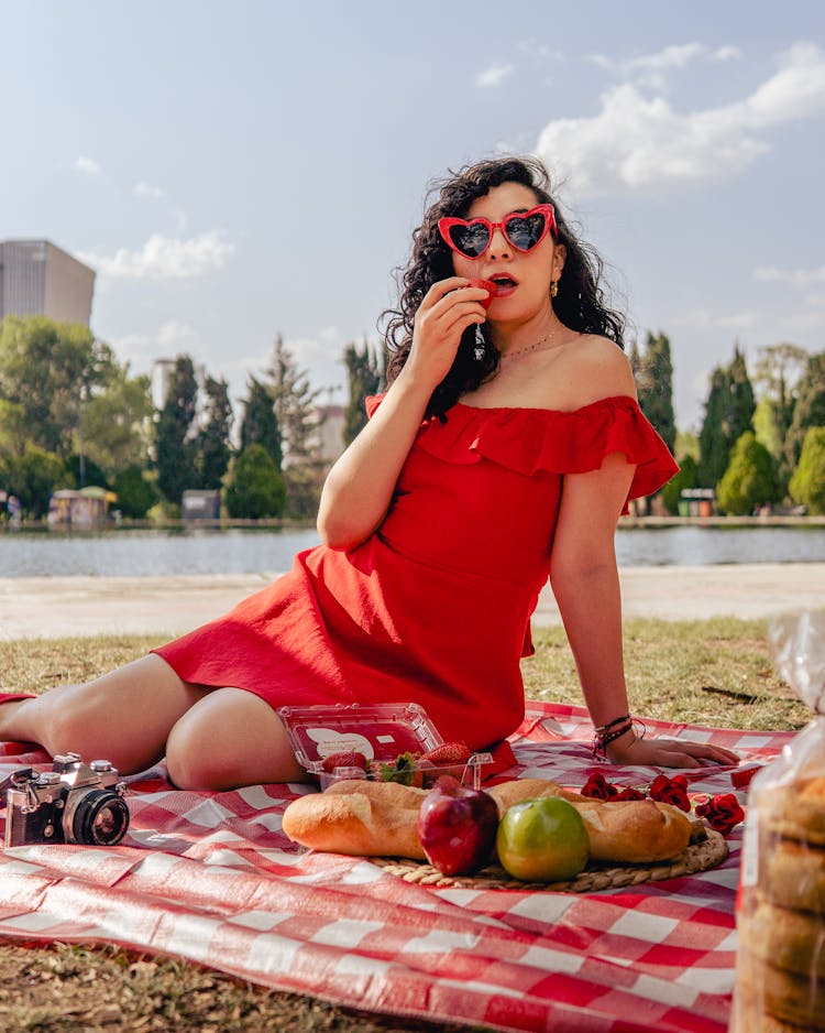 Woman In Red Dress Eating Fruit 