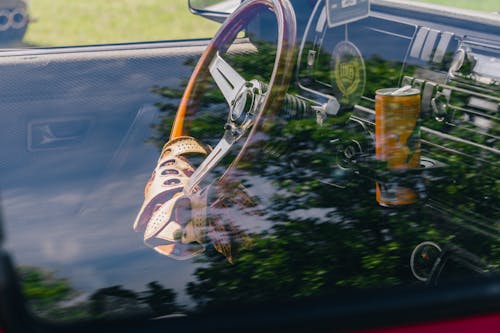 Photograph of Gloves on a Steering Wheel