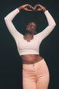 Woman in White Long Sleeve Crop Top and White Denim Shorts Raising Her Hands
