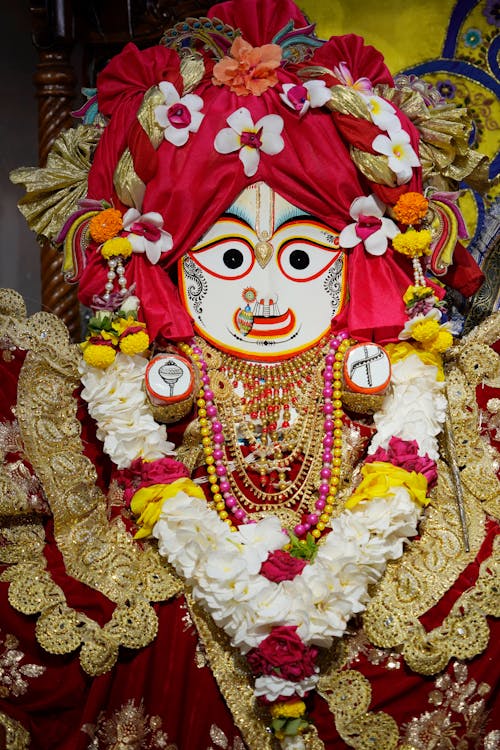 Free Sculpture of Deity Jagannath Subhadra Decorated with Flowers and Bead Necklaces   Stock Photo